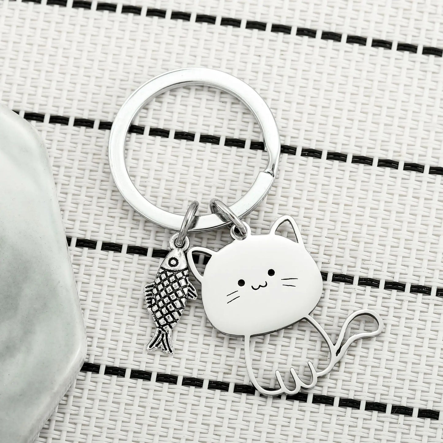 Cat Eyeing the Fish Keychain