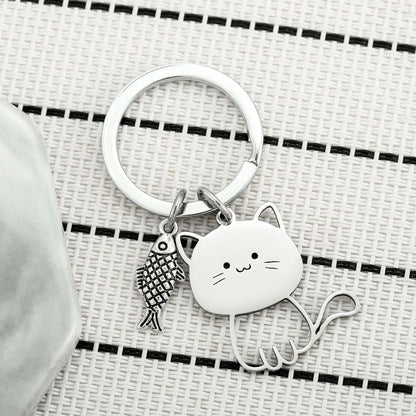 Cat Eyeing the Fish Keychain